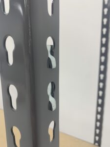 A properly installed shelf clips sits in a shelving column